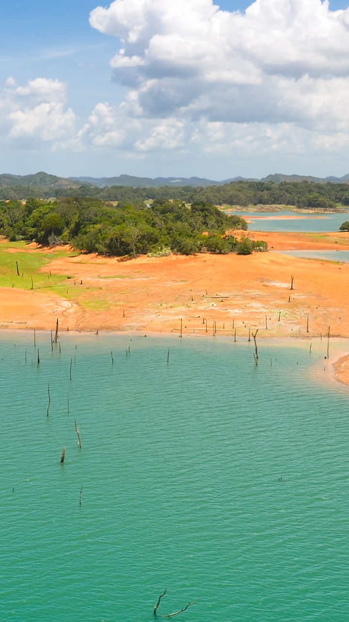 Scenic lake with islands under blue sky