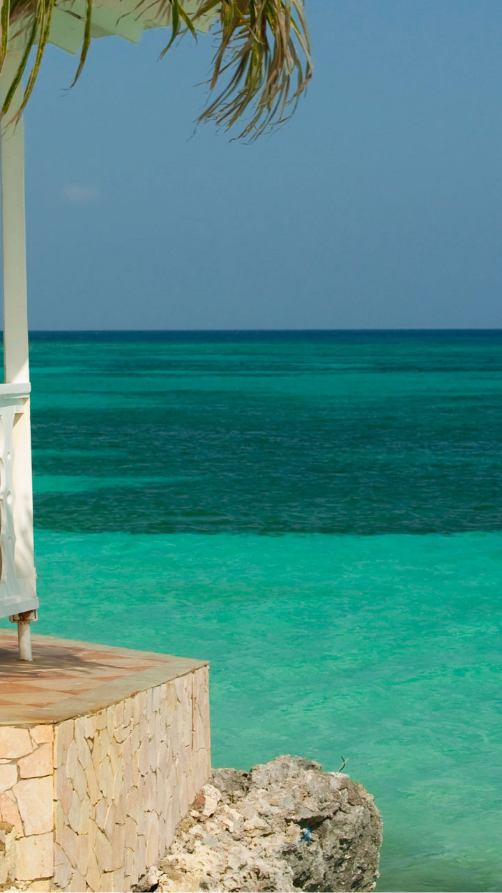 Tropical gazebo by turquoise ocean waters