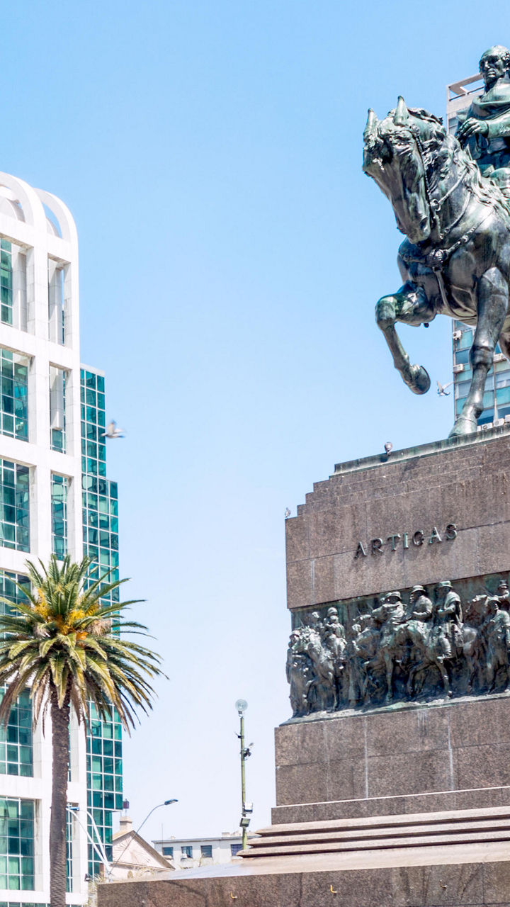 Equestrian statue in urban plaza setting