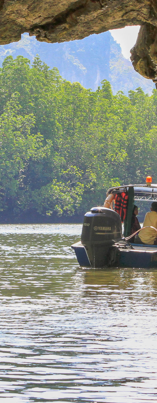 Boat tour through scenic cave opening
