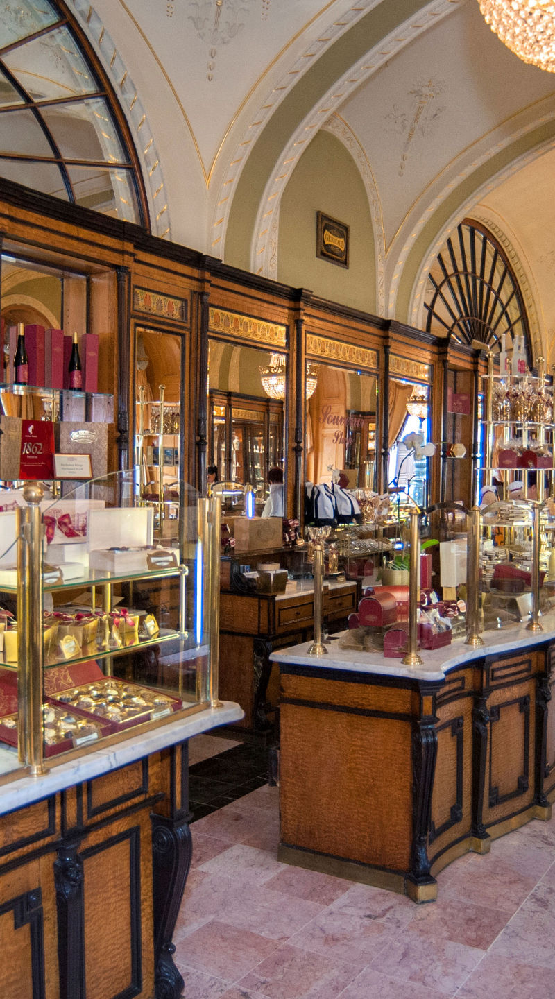 Elegant European pastry shop with chandeliers