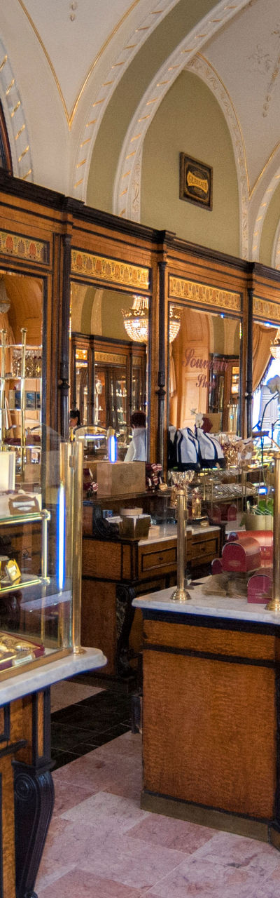 Elegant European pastry shop with chandeliers