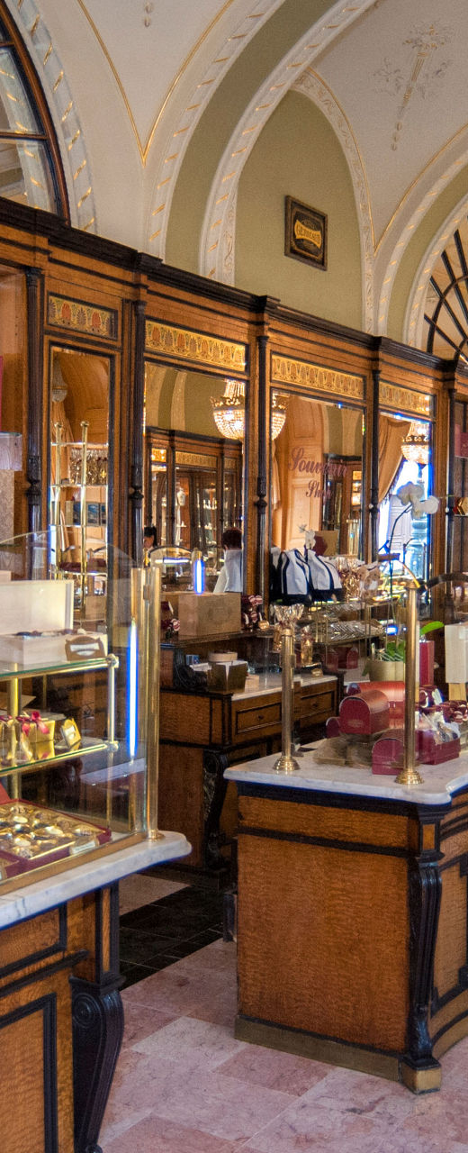 Elegant European pastry shop with chandeliers