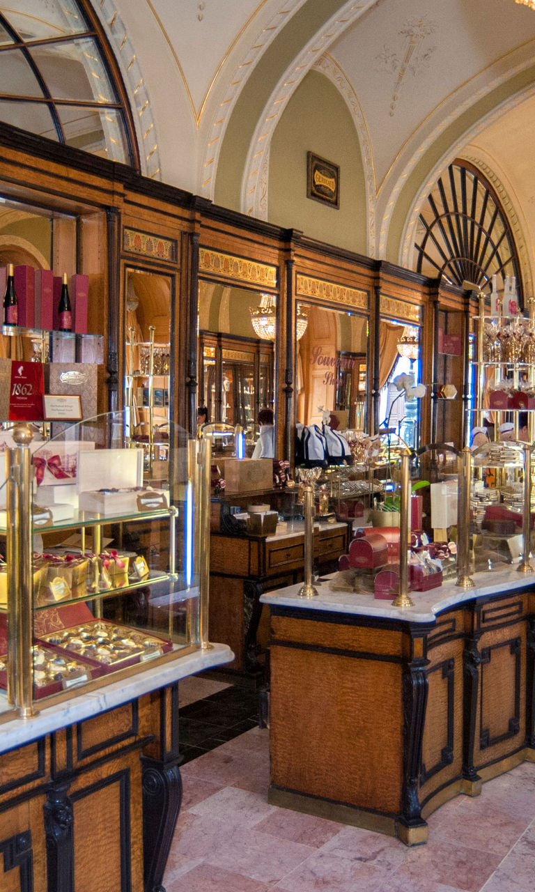 Elegant European pastry shop with chandeliers