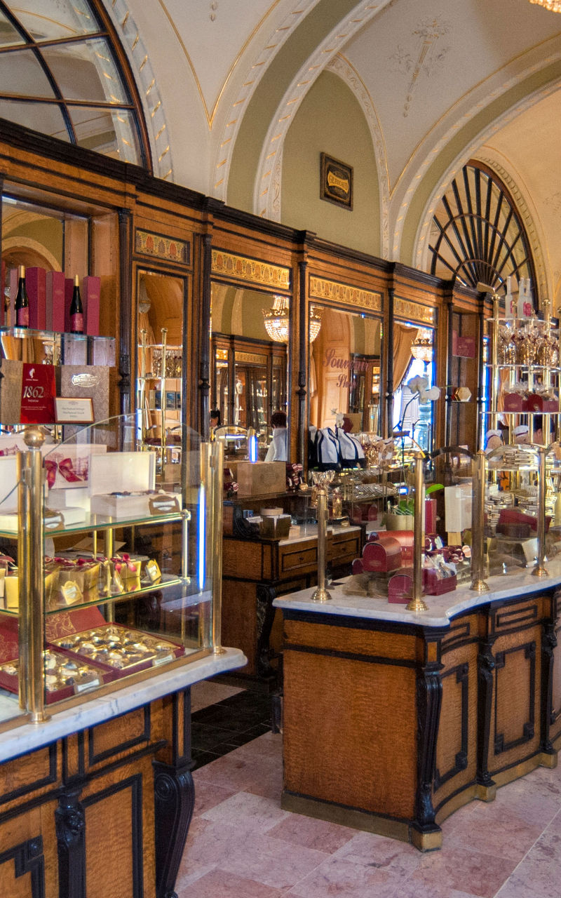 Elegant European pastry shop with chandeliers