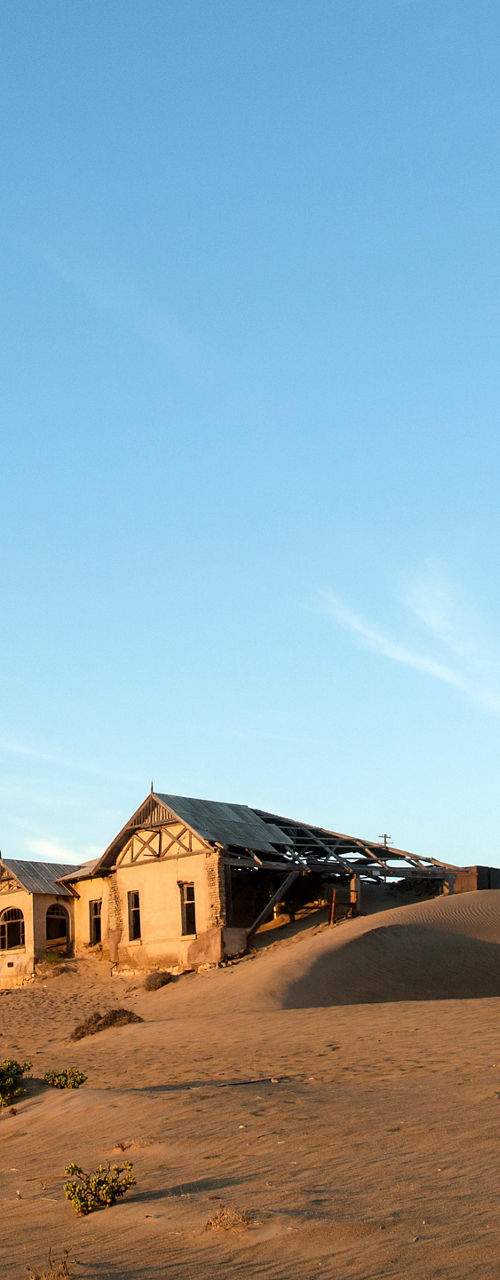 Abandoned desert buildings under clear sky