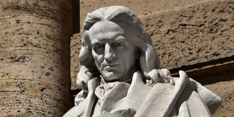 Marble statue of robed historical figure