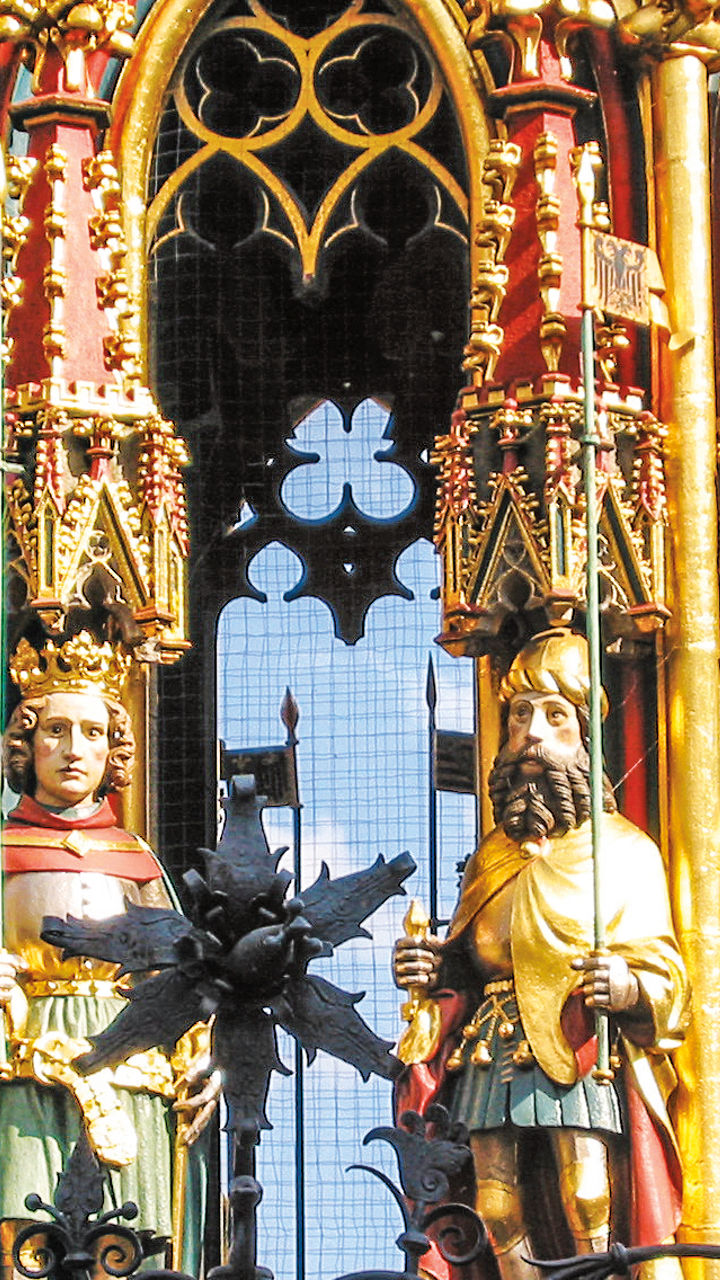 Ornate medieval fountain with statues