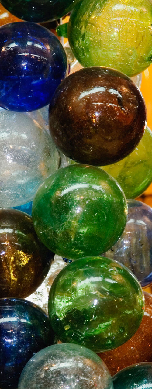 Colorful glass ornaments in vibrant market