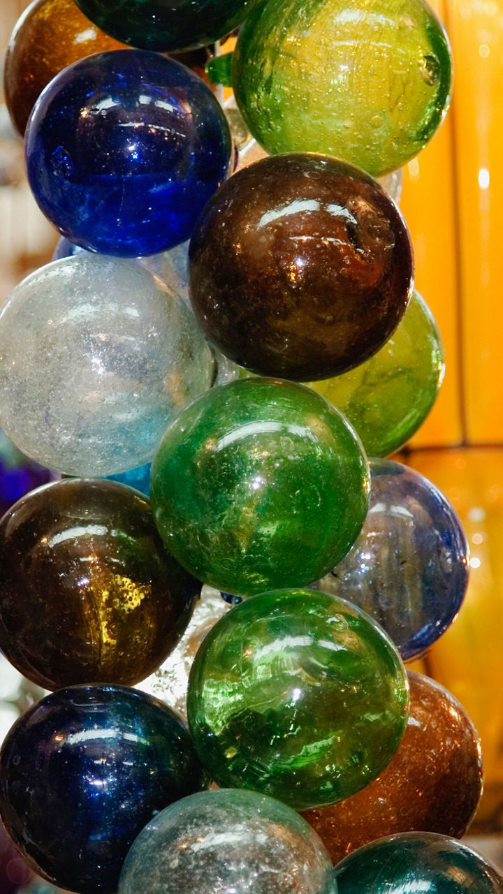 Colorful glass ornaments in vibrant market