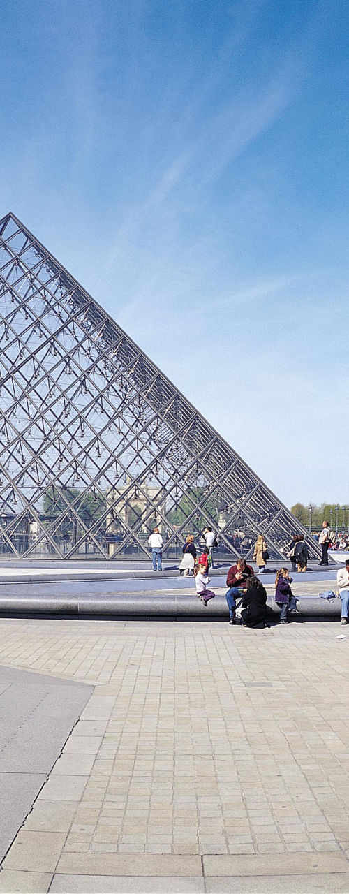 Louvre Museum courtyard with glass pyramid