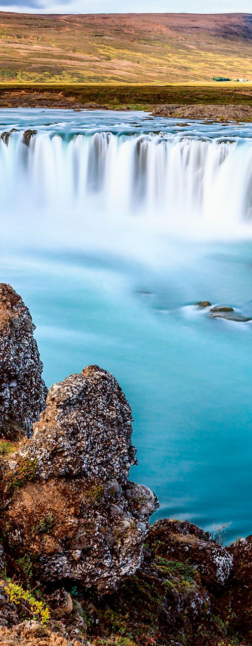 Scenic waterfall with rocky foreground