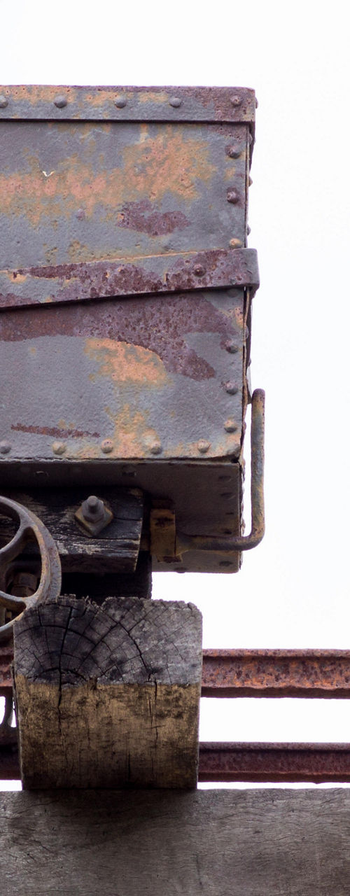 Rustic mining cart on wooden tracks