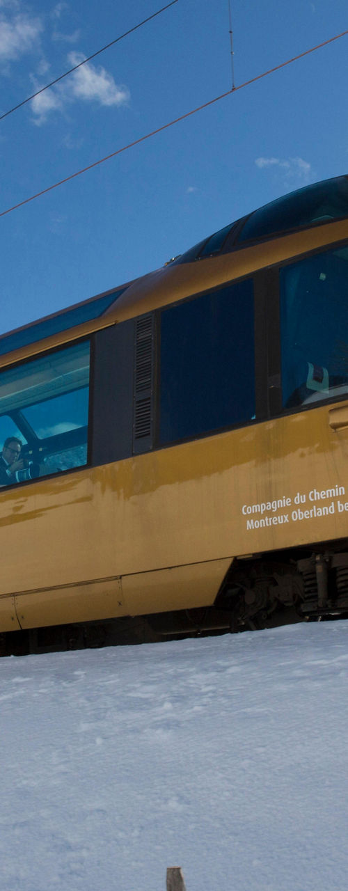 GoldenPass panoramic train in snowy mountains