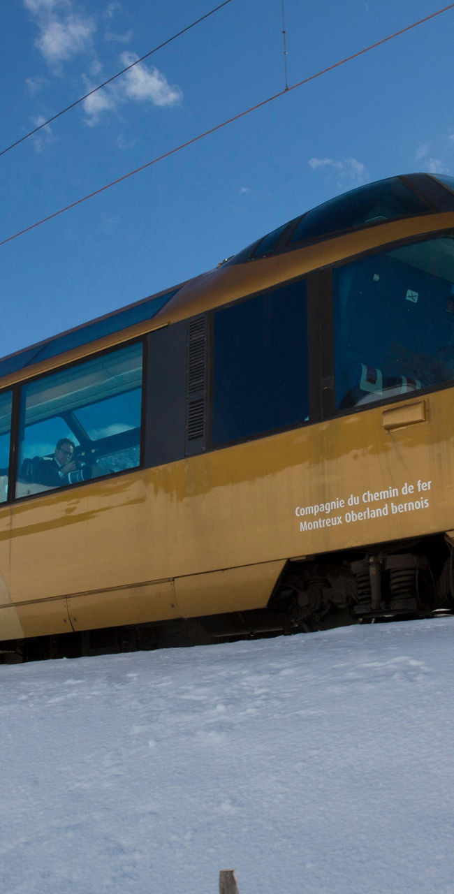 GoldenPass panoramic train in snowy mountains