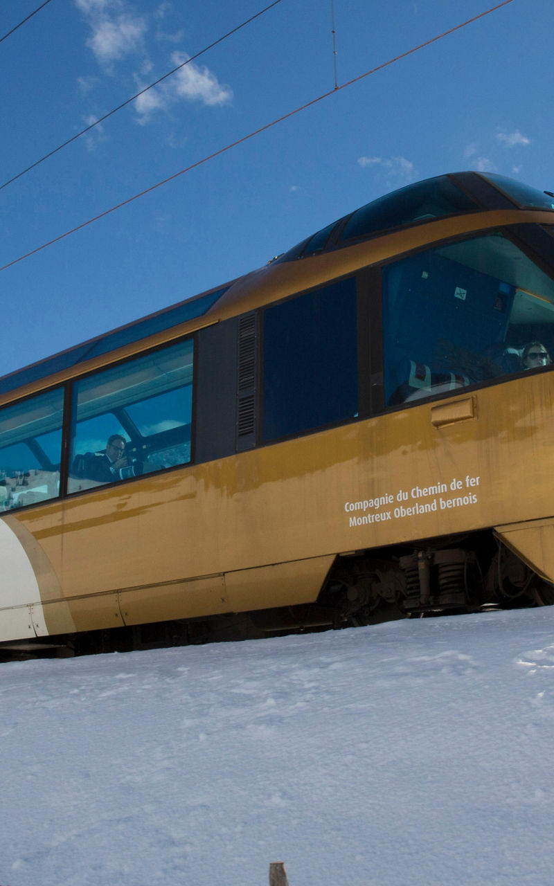 GoldenPass panoramic train in snowy mountains