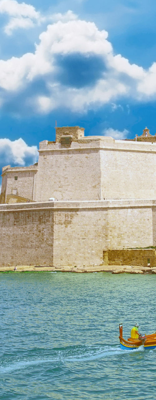 Historic fortress by calm blue waters