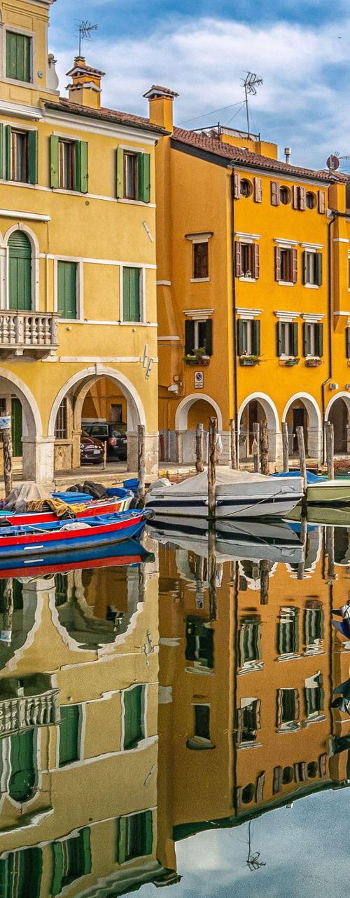 Colorful waterfront buildings with docked boats