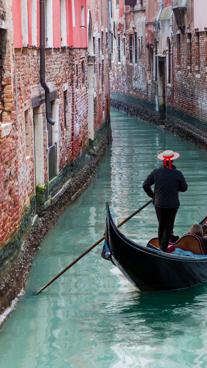 Gondola Ride Through Venetian Canal