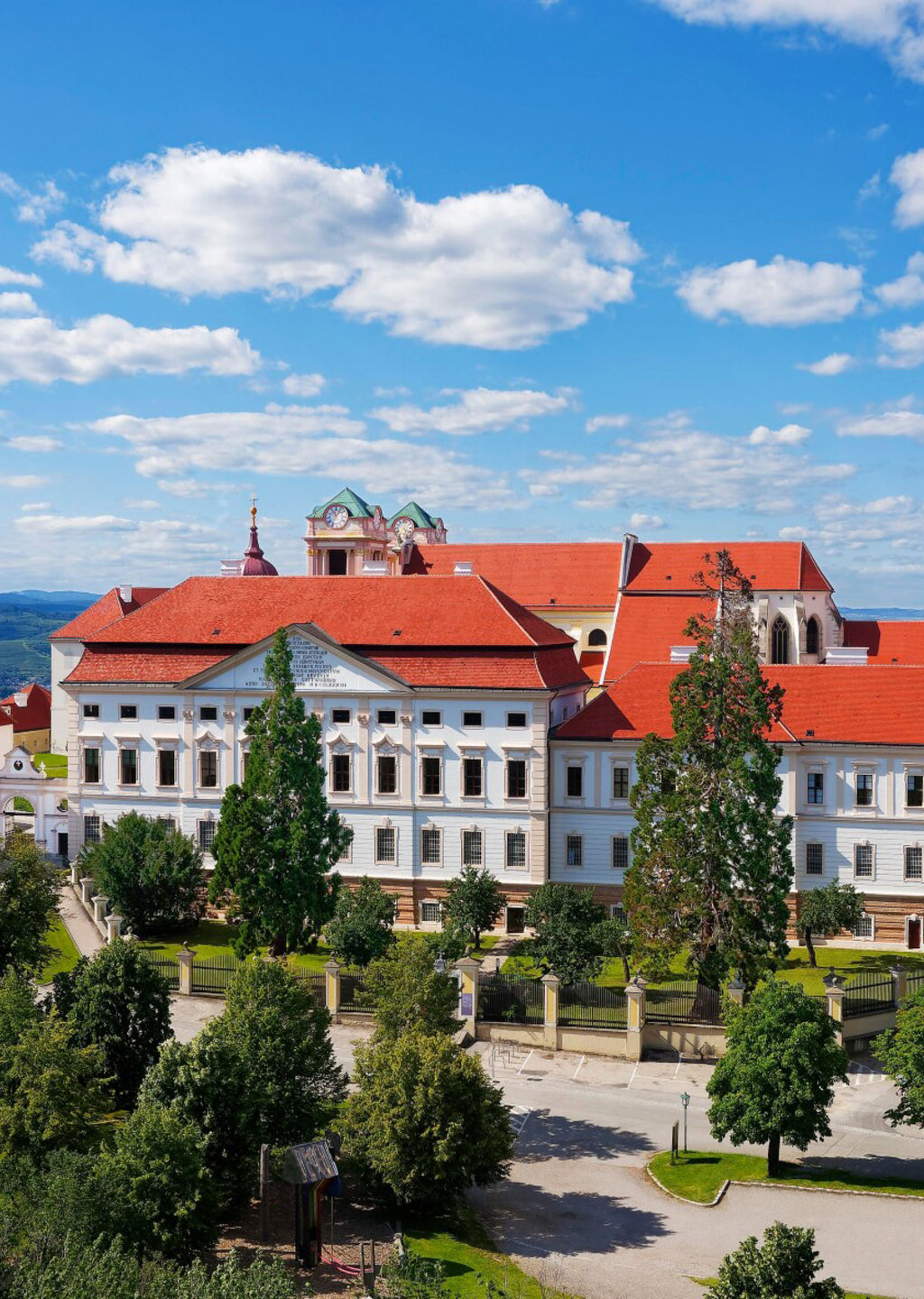 Historic hilltop monastery with red roofs