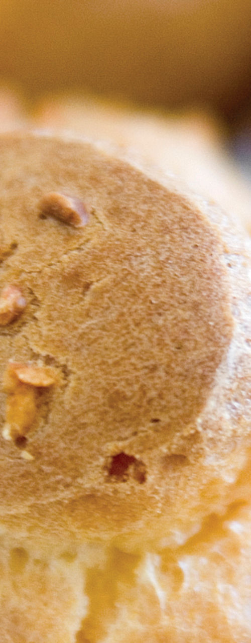 Freshly baked bread rolls on cooling rack