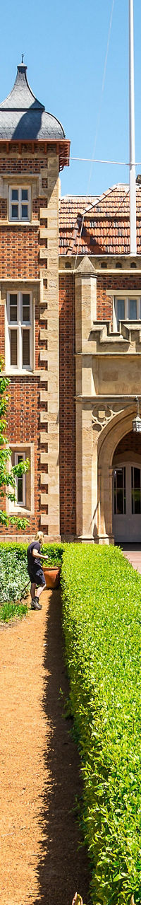 Historic brick building with garden pathway