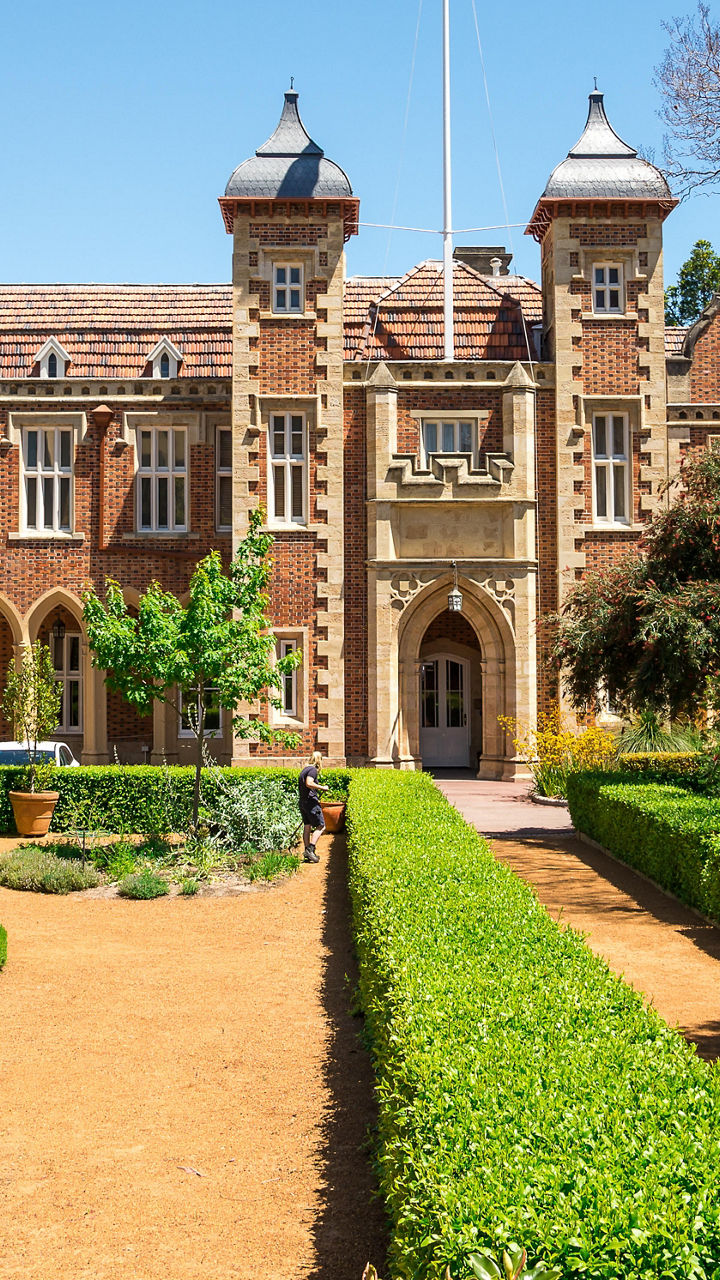 Historic brick building with garden pathway