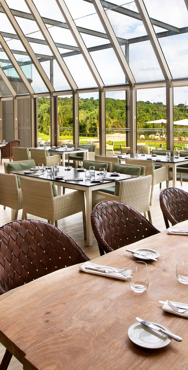 Modern restaurant with glass wall and scenic view