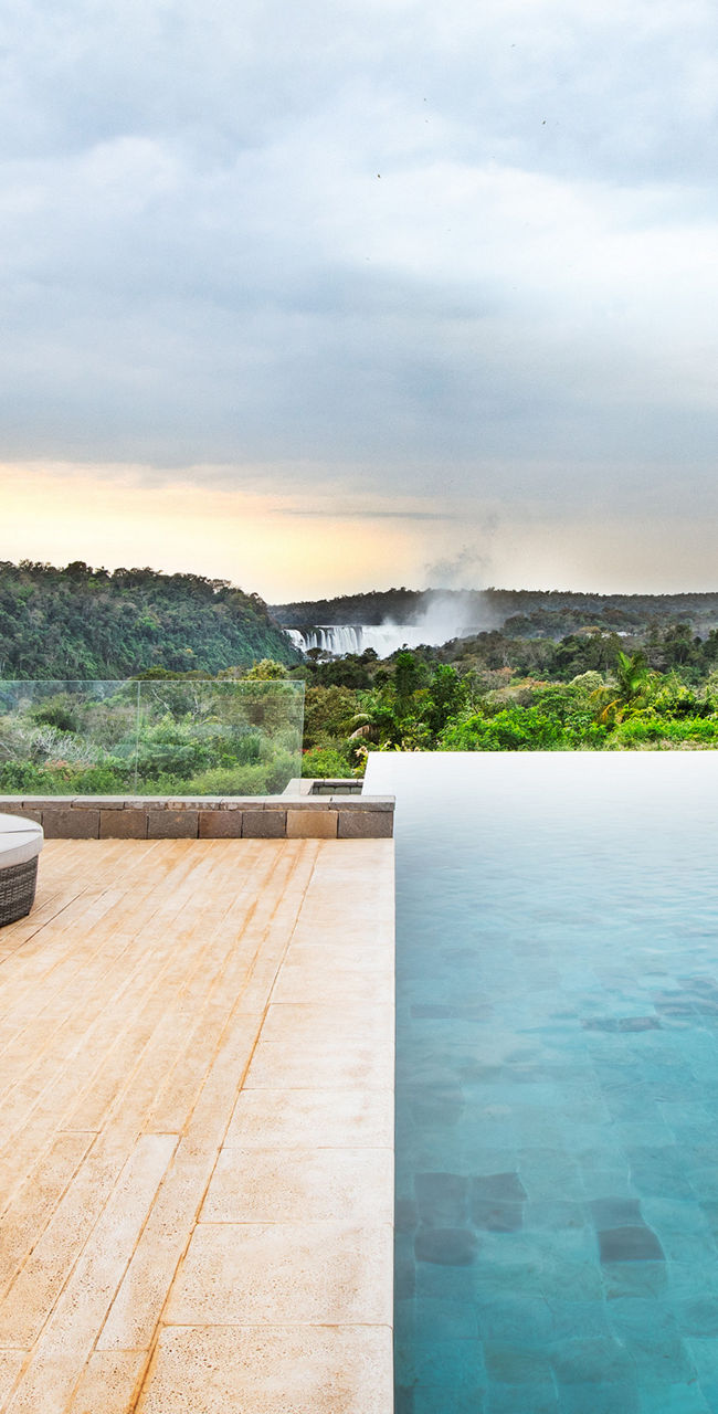 Luxury poolside with scenic forest view