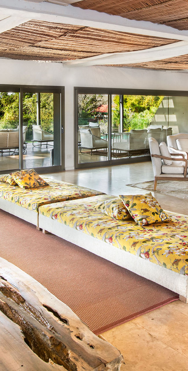 Spacious tropical living room with scenic view