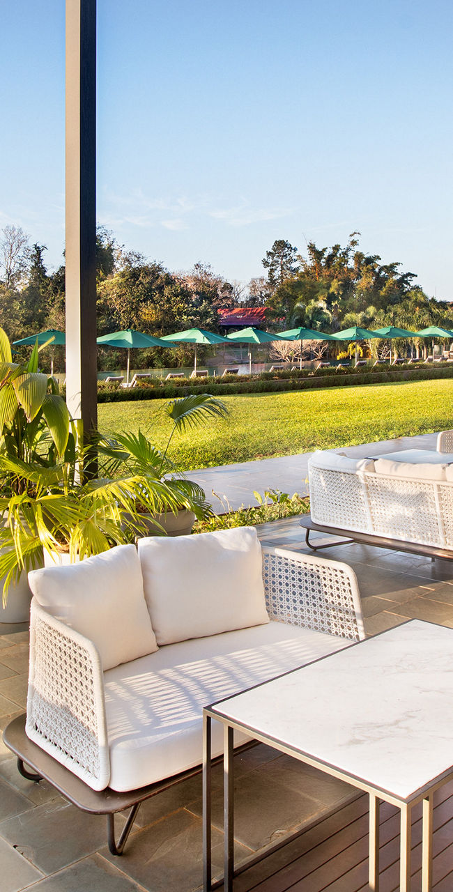Modern outdoor patio overlooking lush landscape