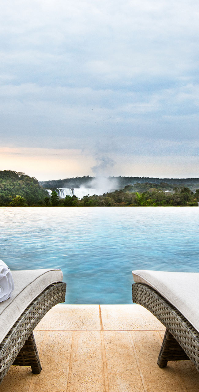 Luxury poolside view with loungers