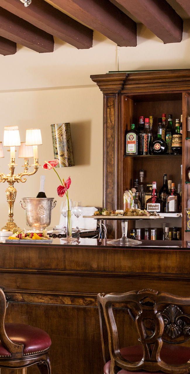 Elegant wooden bar with seating area