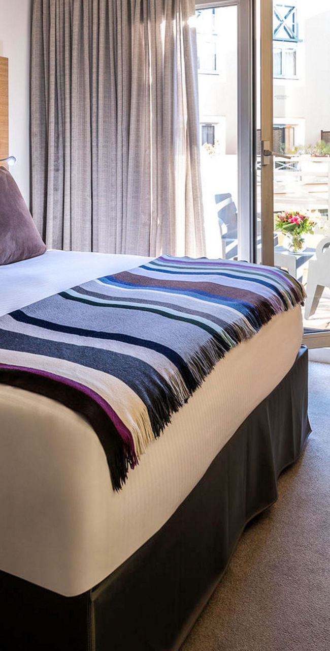 Modern hotel room with cozy decor