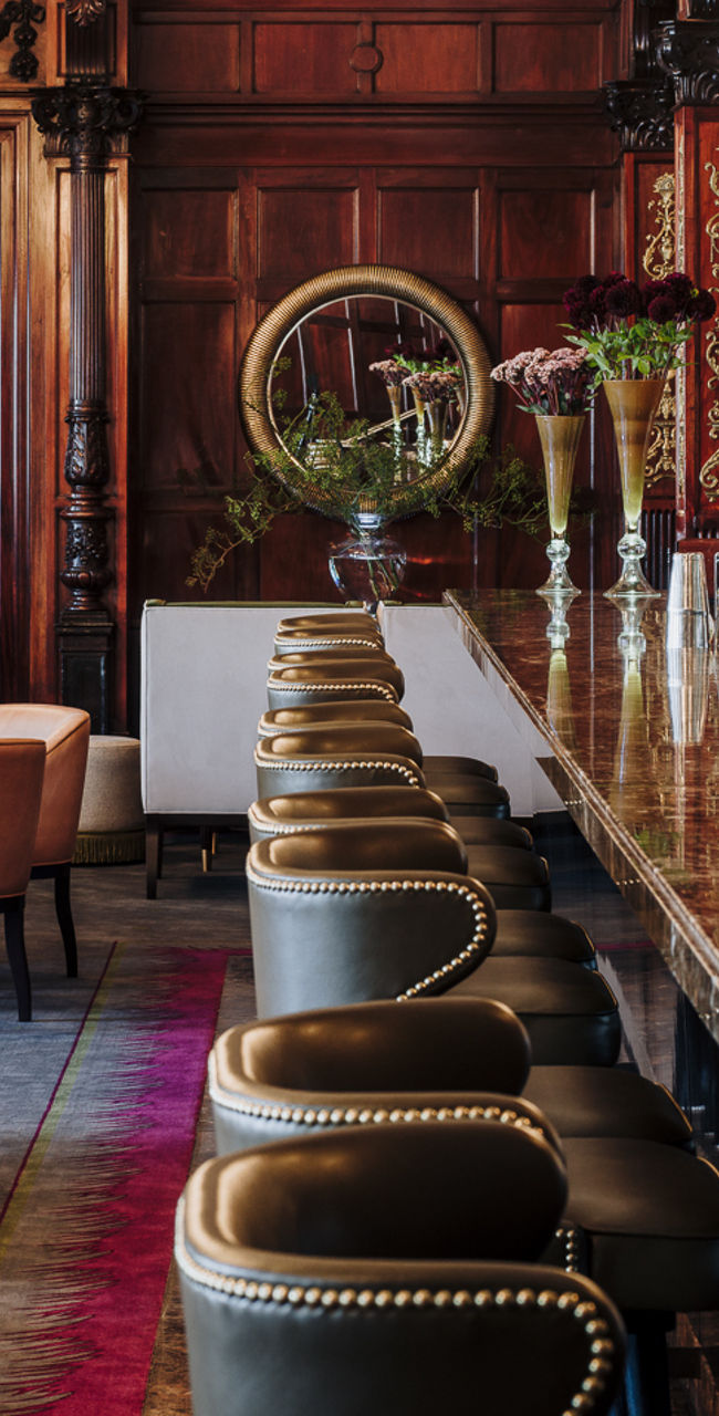 Elegant hotel bar with ornate wooden decor