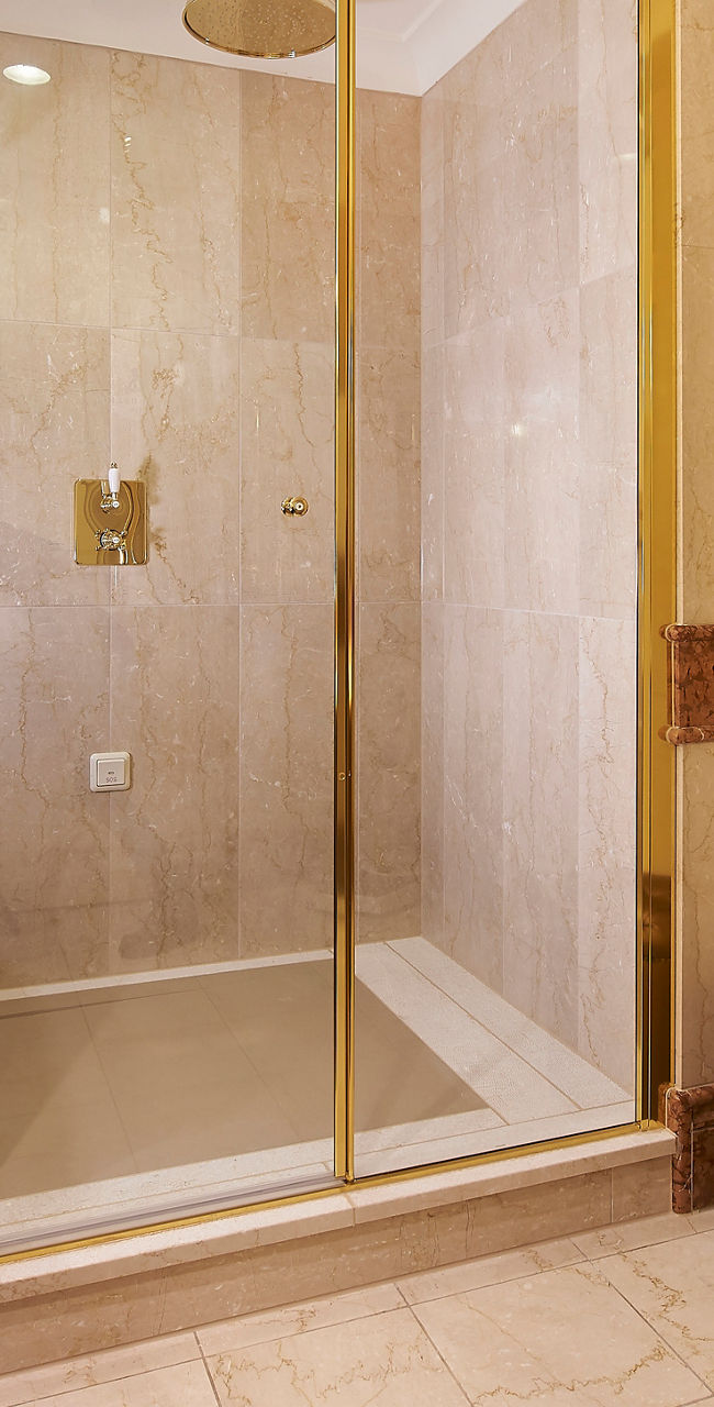 Luxurious hotel bathroom with glass shower