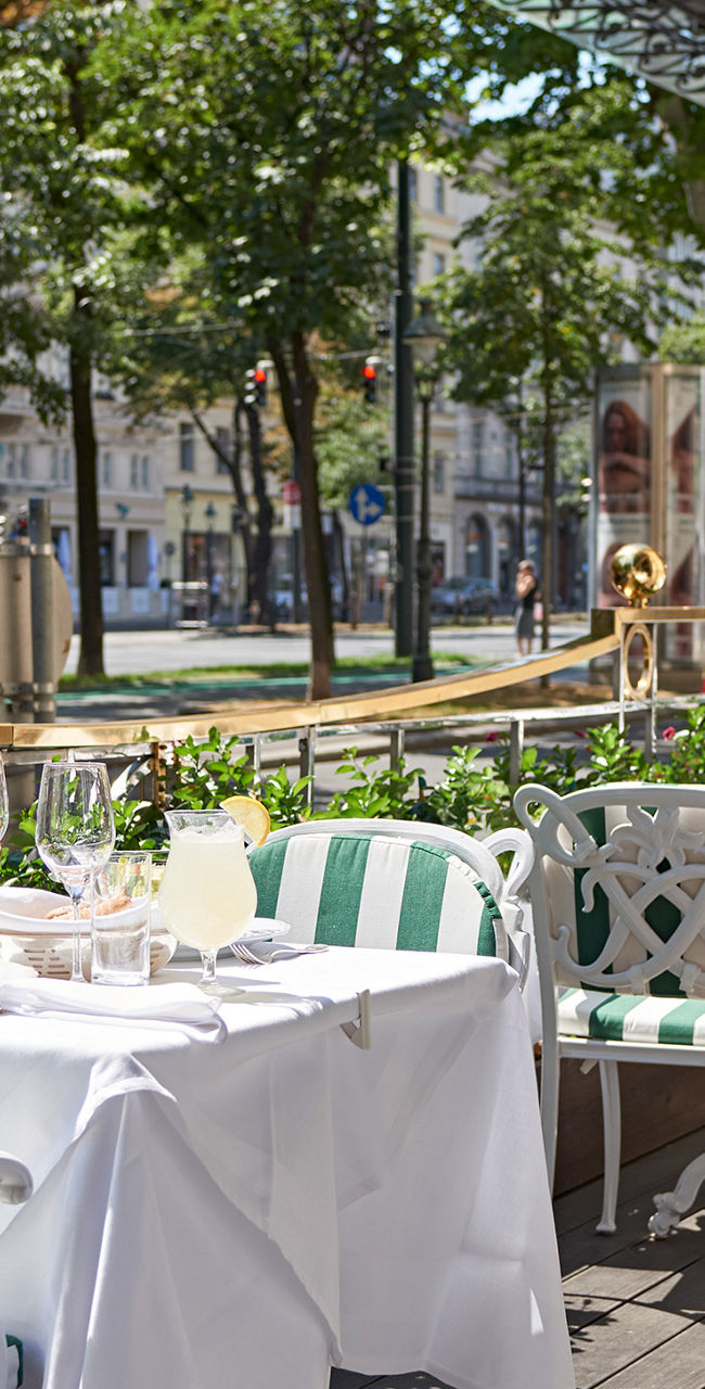 Elegant outdoor café with striped chairs