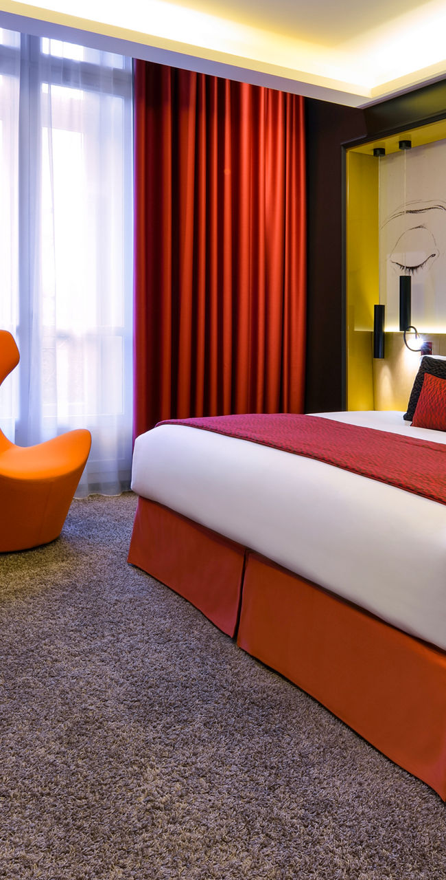 Modern hotel room with vibrant decor