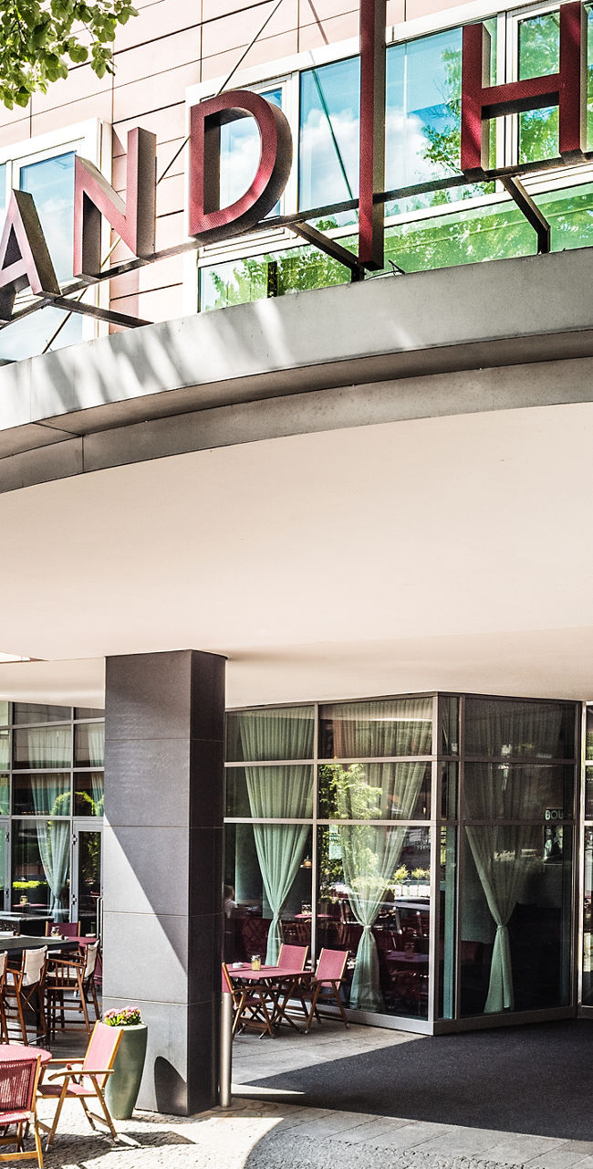 Grand Hyatt hotel entrance with outdoor seating