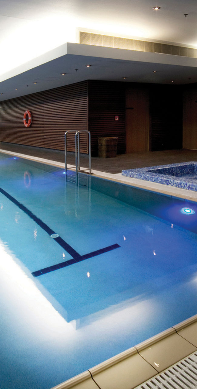 Indoor swimming pool with jacuzzi area