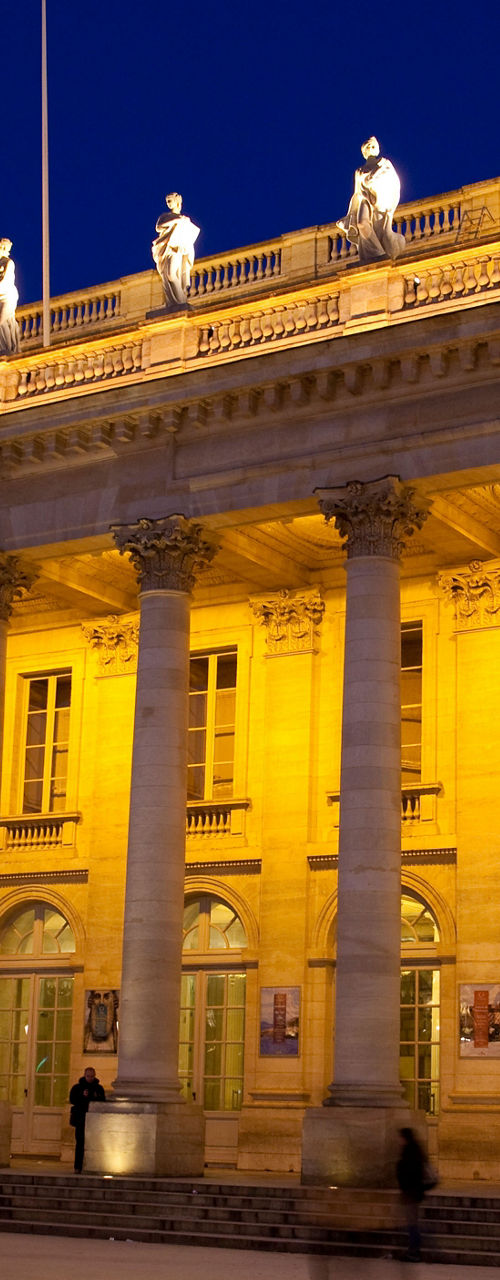 Illuminated historic theater at night
