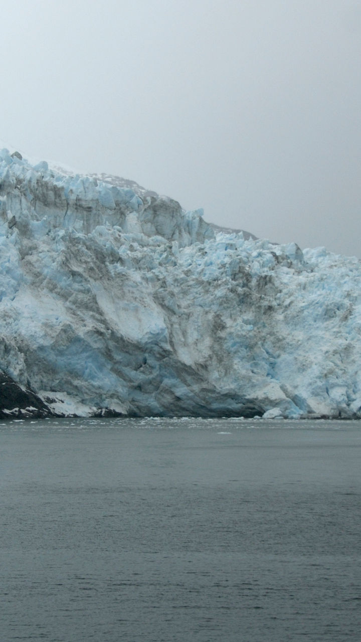 Majestic glacier meeting calm waters