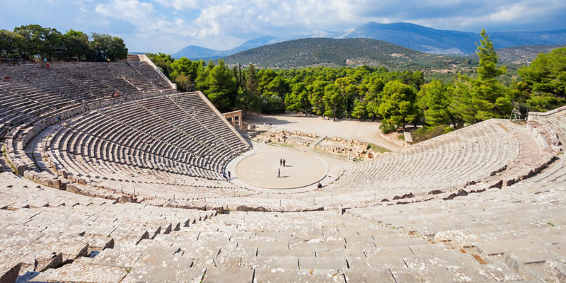 Ancient amphitheater with scenic mountain view