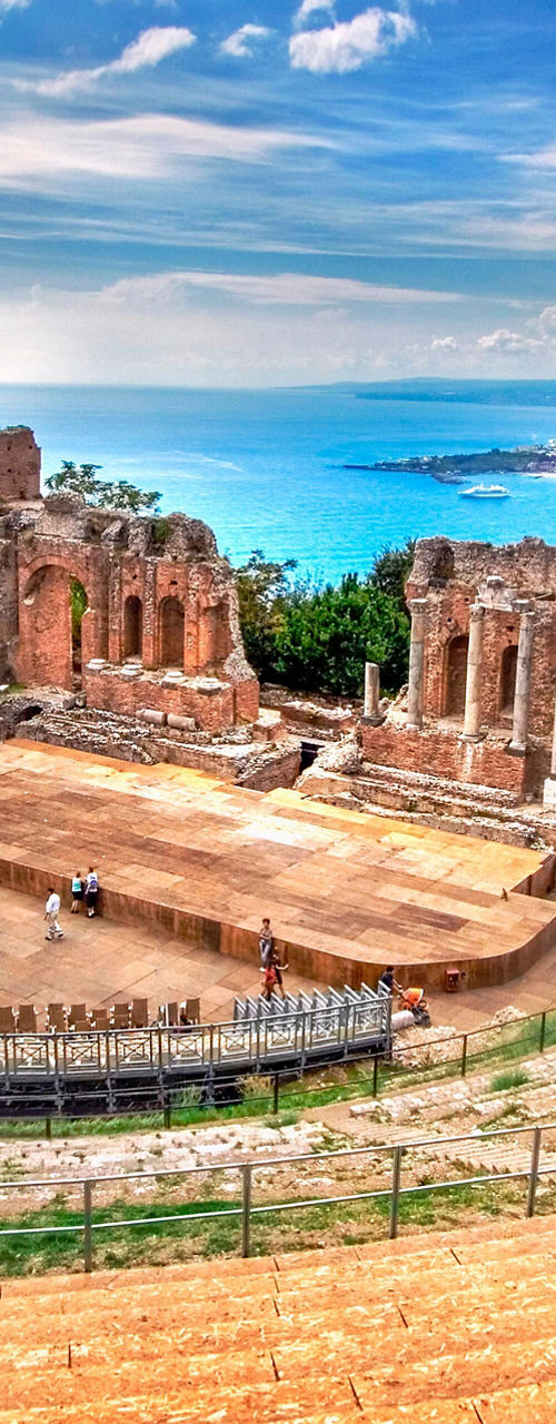 Ancient amphitheater overlooking scenic coastline