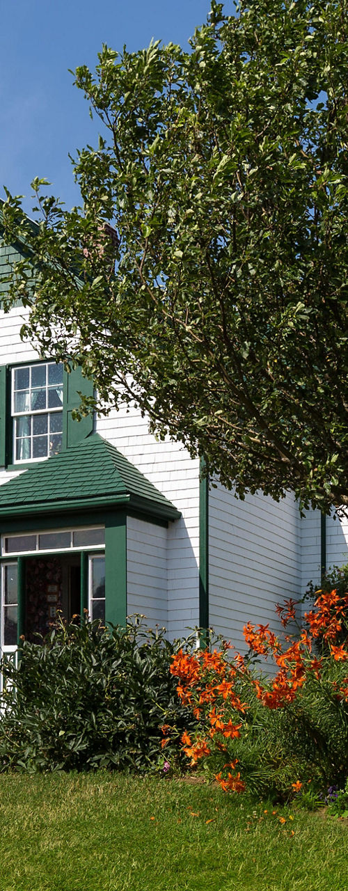 Charming white house with green accents