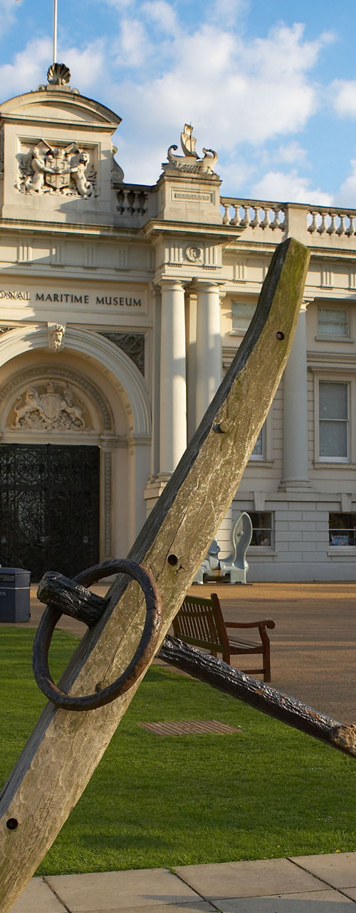 Historic maritime anchor outside grand building