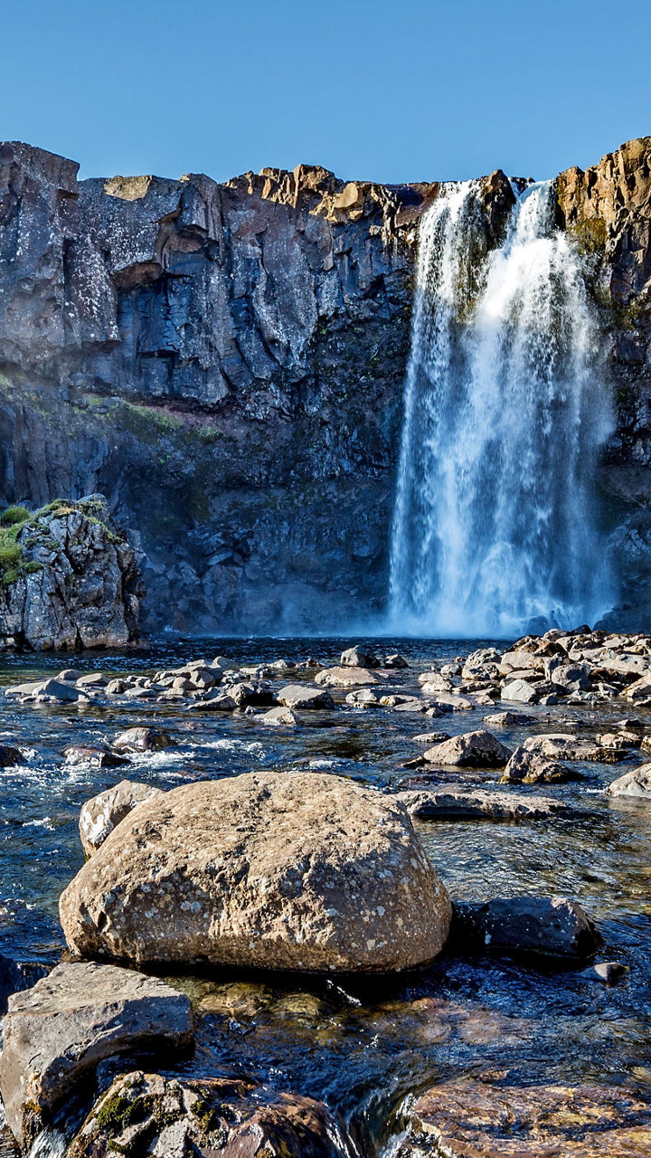 Scenic waterfall in rocky mountain landscape