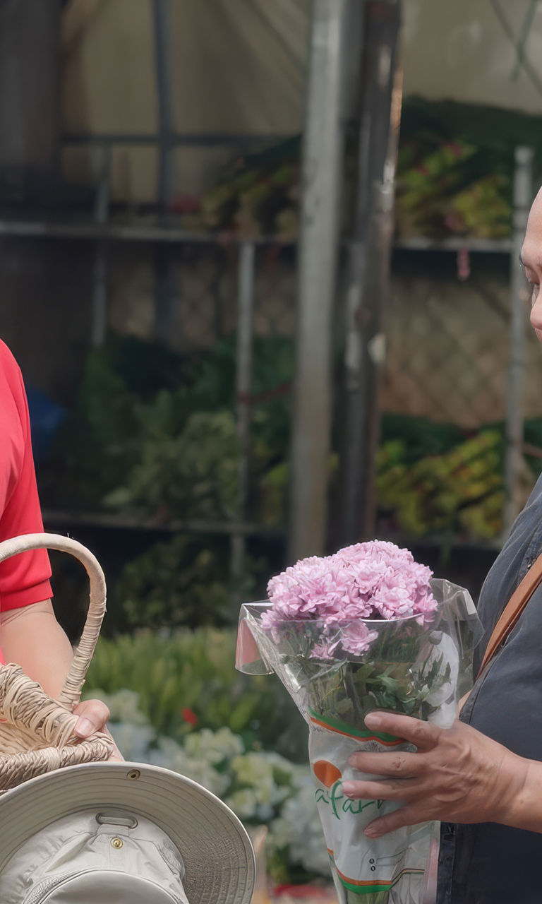 Flower market interaction with basket and bouquet