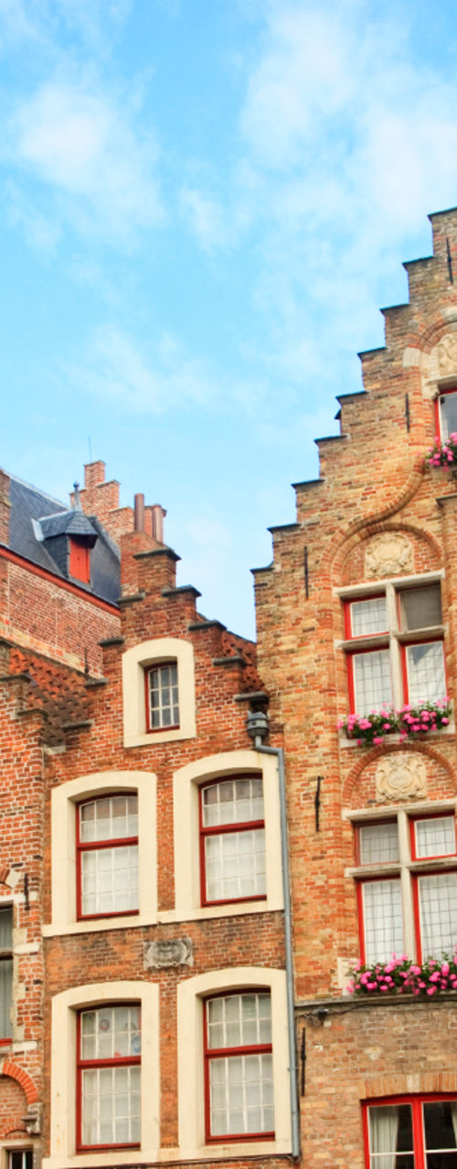 Colorful historic buildings in Bruges square