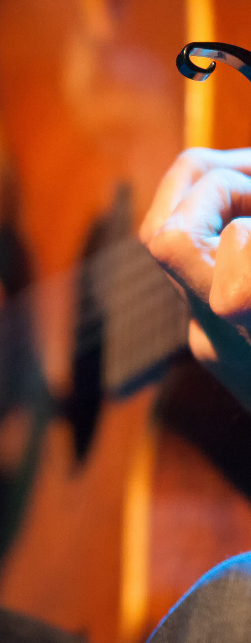 Acoustic guitarist performing on stage close-up